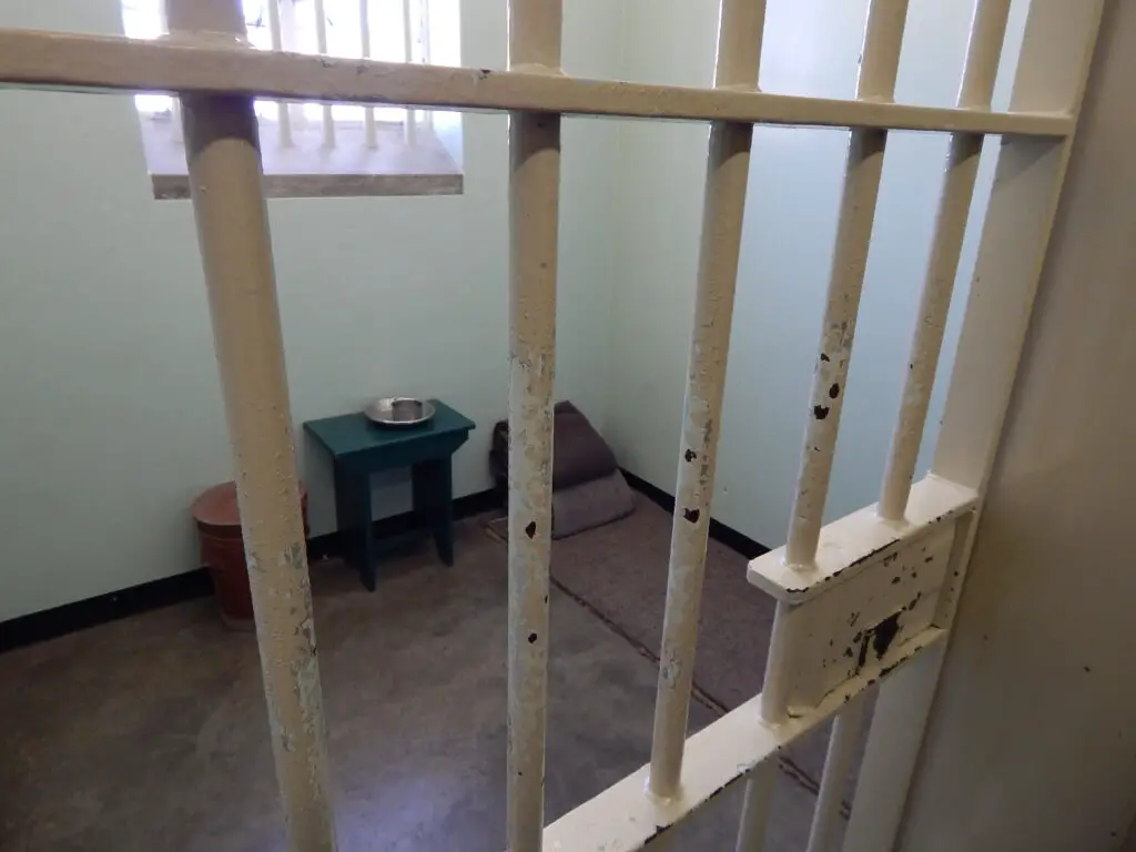  Nelson Mandela's humble cell in Robben Island, where the spirit of resilience echoes through the walls.