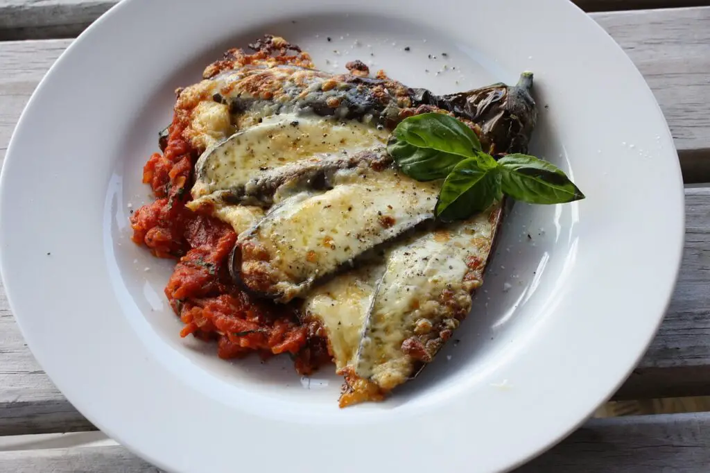  the essence of tradition in every layer of this authentic Eggplant Parmigiana. 