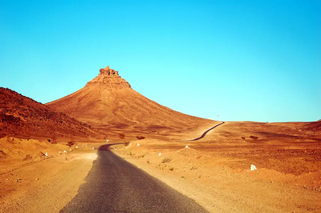 the essence of route planning in Morocco, showcasing the anticipation of exploration and the allure of unknown paths.
