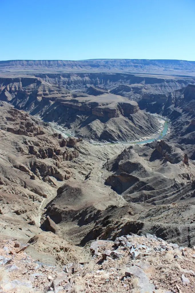  the grandeur of Fish River Canyon, Africa's largest canyon, as it majestically cuts through the Namibian landscape