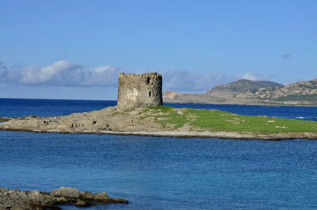 Silent sentinel of the Sardinian coast, this ancient tower stands tall, where land and sea embrace. 