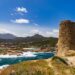 Guarding the pristine Sardinian coast, a historic tower stands tall, bearing witness to centuries of maritime history.